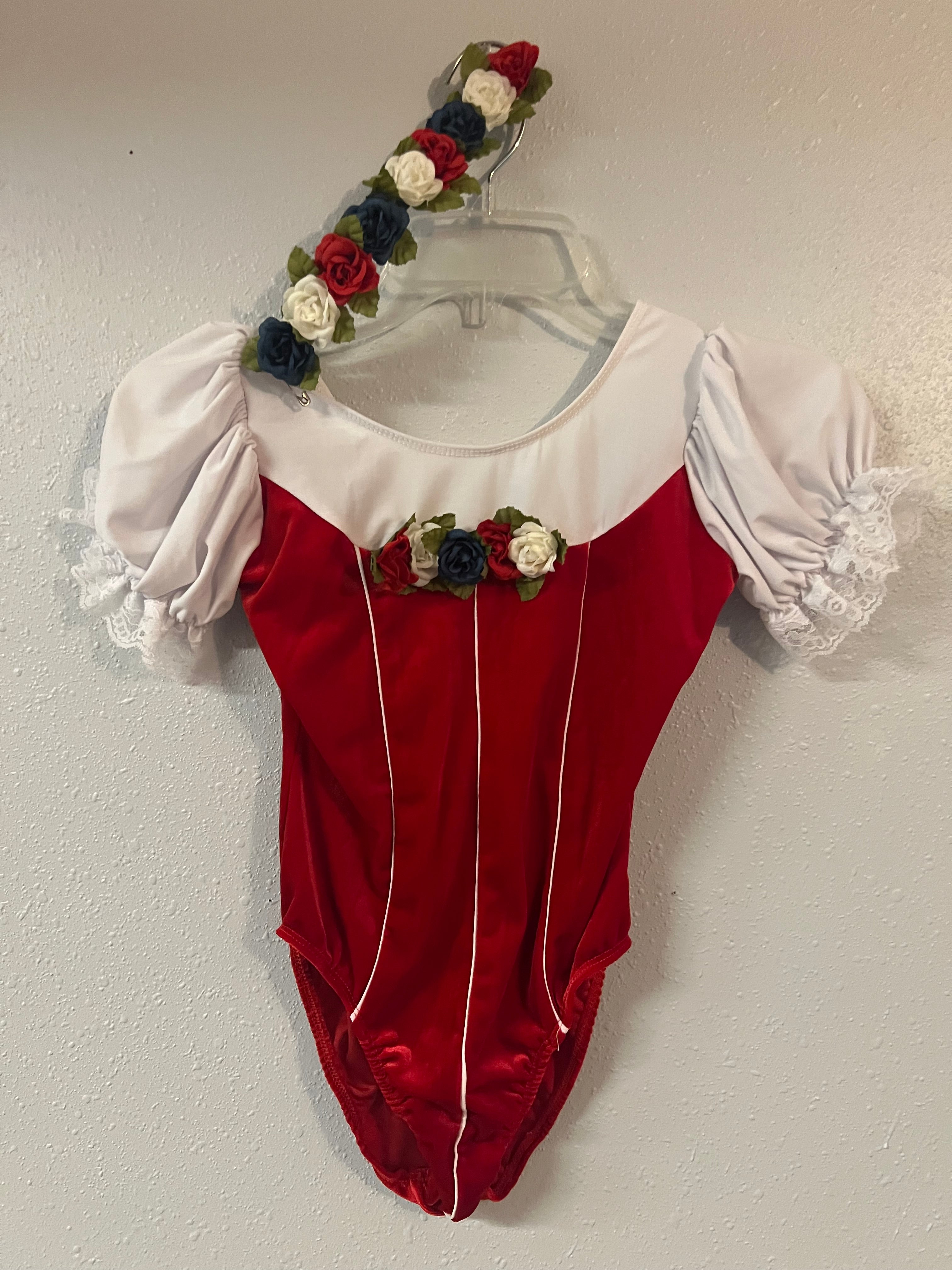 Red and white Leo with silver flower hair piece.  CM