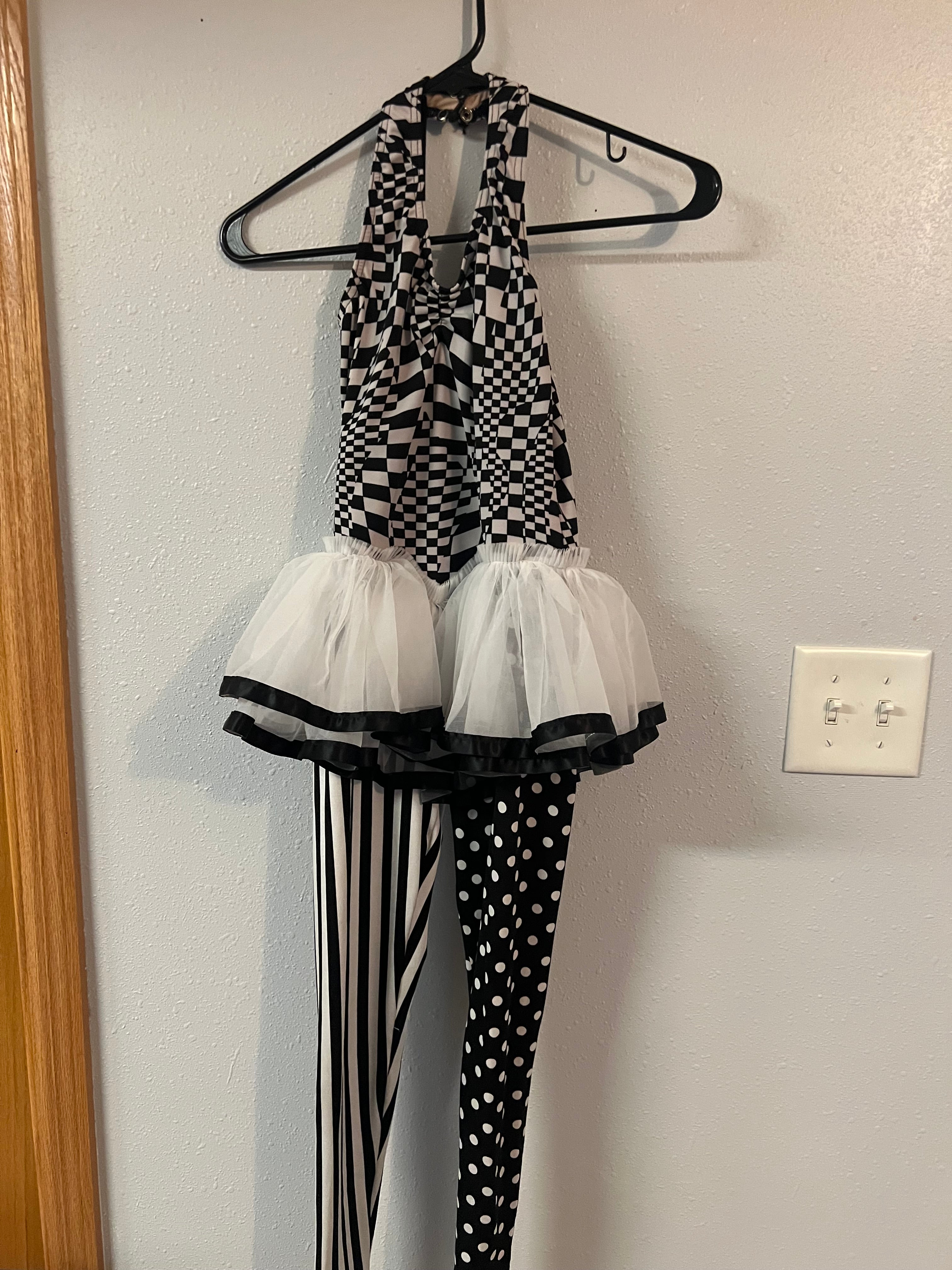 BLACK AND WHITE CHECKED ONE PIECE WITH LEGGINGS AND TUTU.  CM