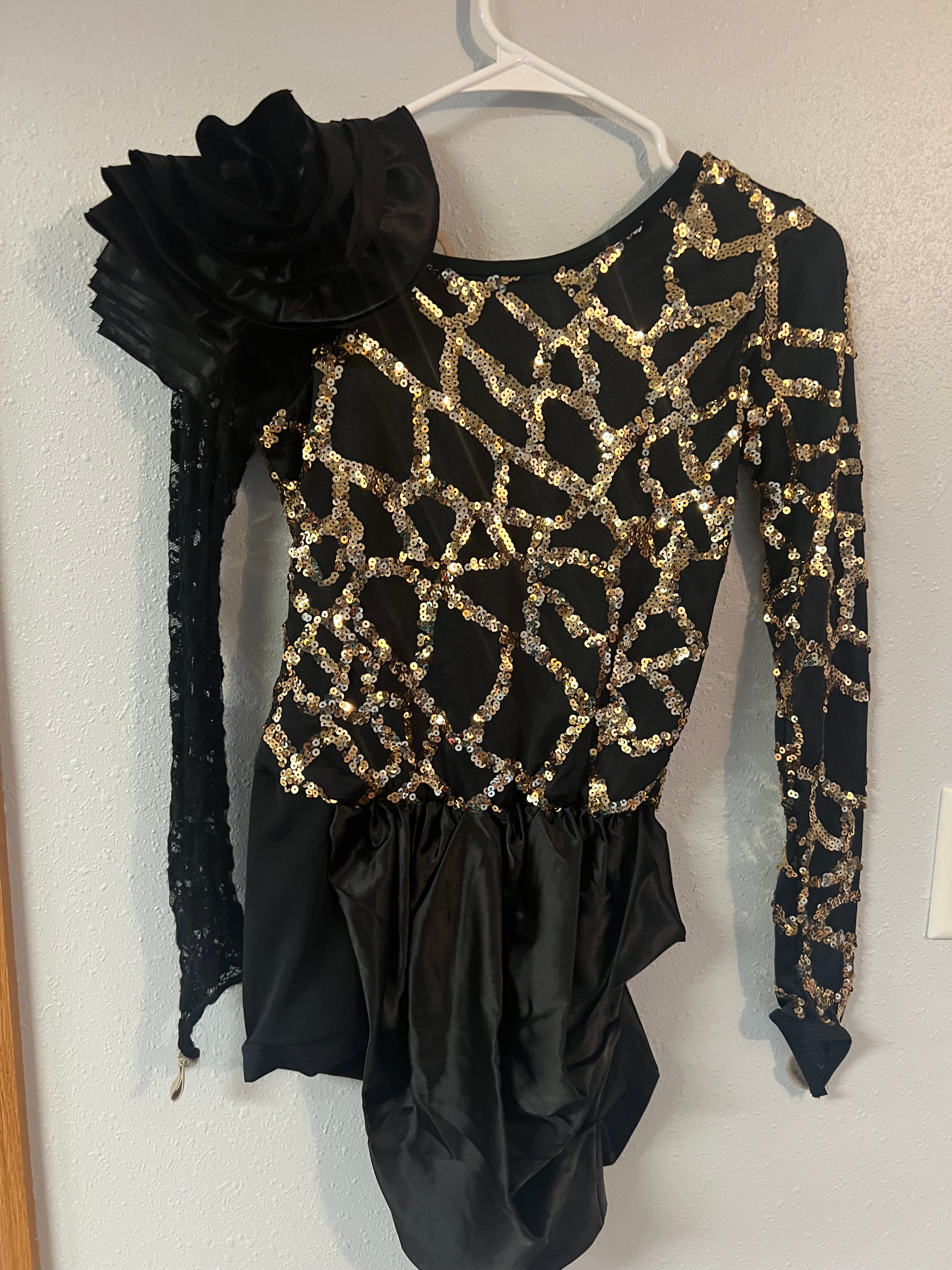 BLACK AND GOLD WITH BLACK FLOWER ON SHOULDER
